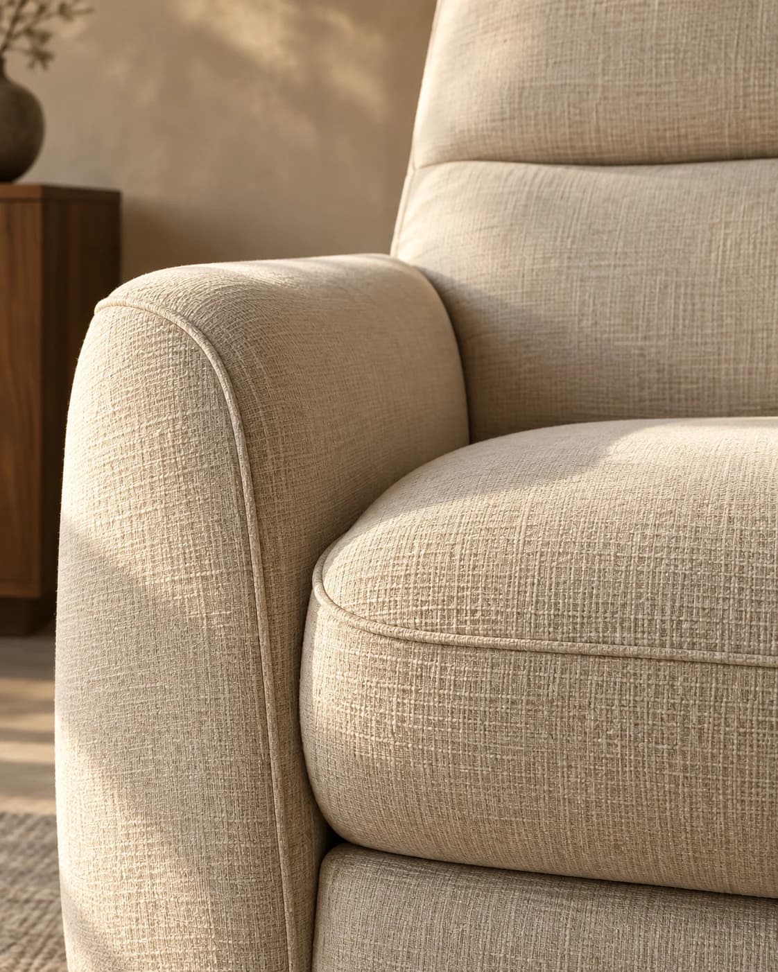 Ivory woven fabric, curved armrest, and cushion piping — a concept material study